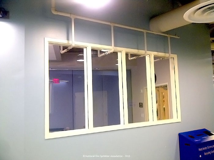 ESR 2397 assembly of deluge sprinklers on fixed glazing as an alternate to 1-2 hour fire resistive glazing