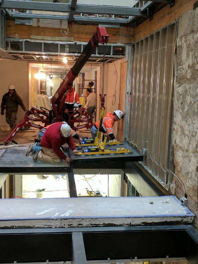 Glaziers installing the GPX FireFloor System at 21c Museum Hotel